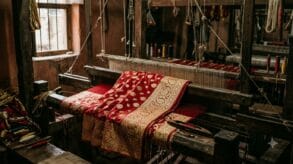 Bridal red Banarasi katan silk saree with gold zari on a wooden pit loom in Varanasi