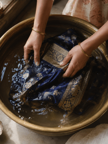 Hand-washing a silk saree in cold water at home