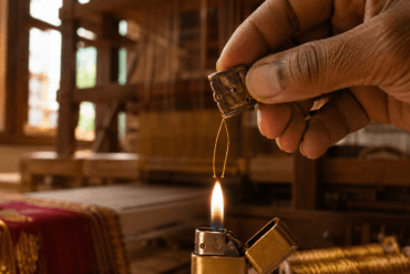 Silk burn test being performed on saree thread to check for pure silk authenticity