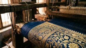 Real zari thread on a Banarasi saree border, tested against Varanasi loom light